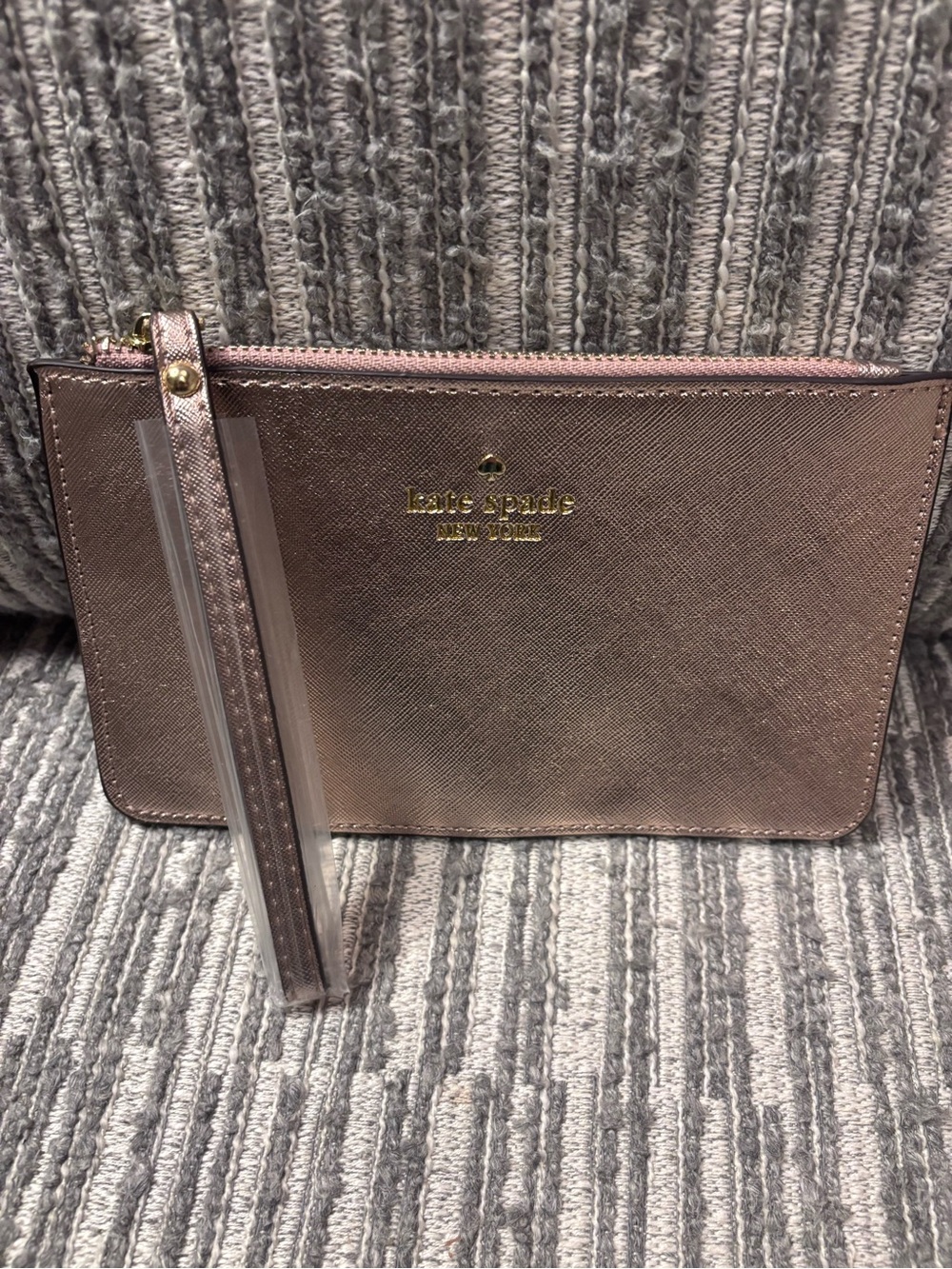 Kate Spade metallic rose gold wristlet strap pouch